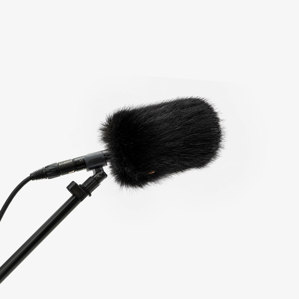 The Foam Wind Cover, size S, on a boom-mounted shotgun microphone
